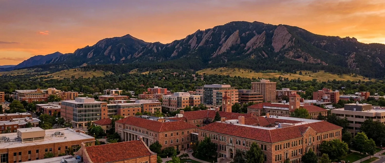 Boulder, Colorado and the University of Colorado campus below the Flatirons at sunset