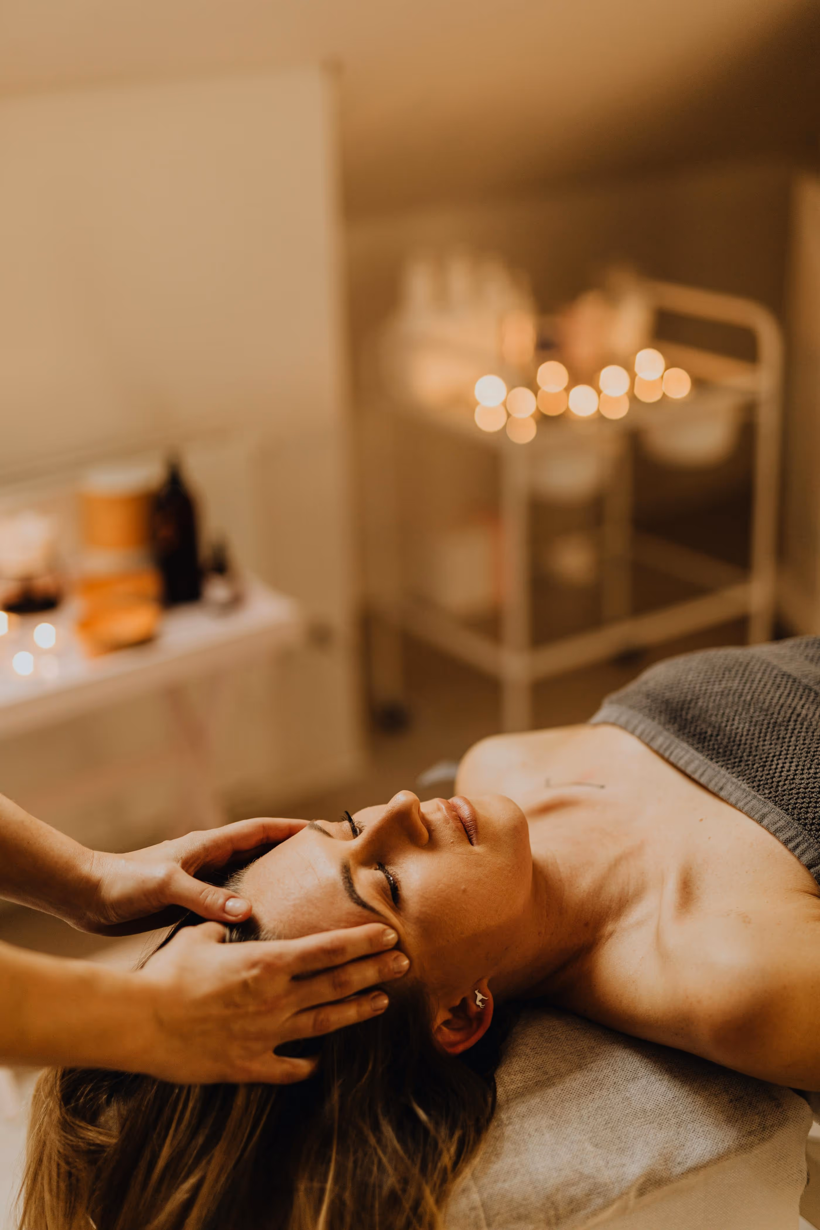 Woman getting a head massage in spa