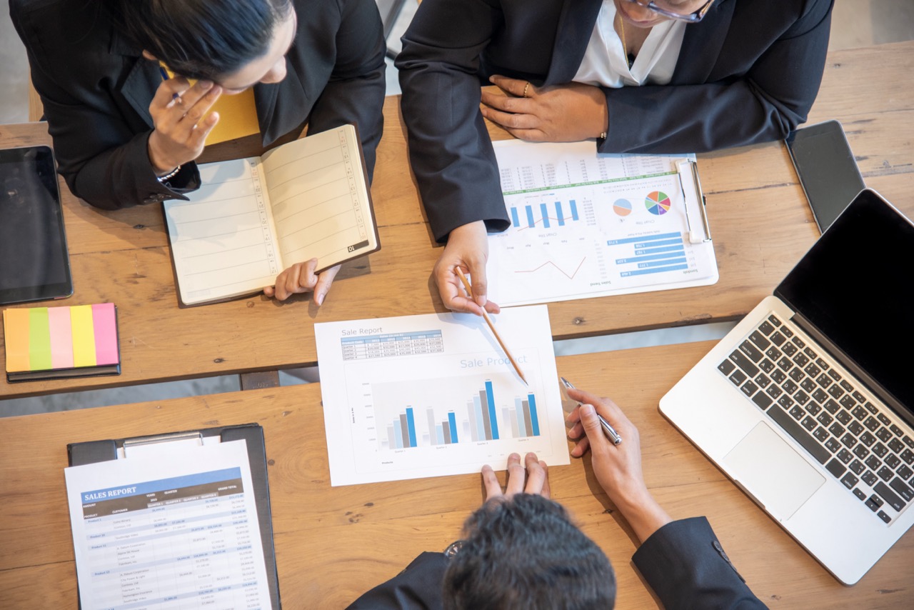Corporate team reviewing financial charts 