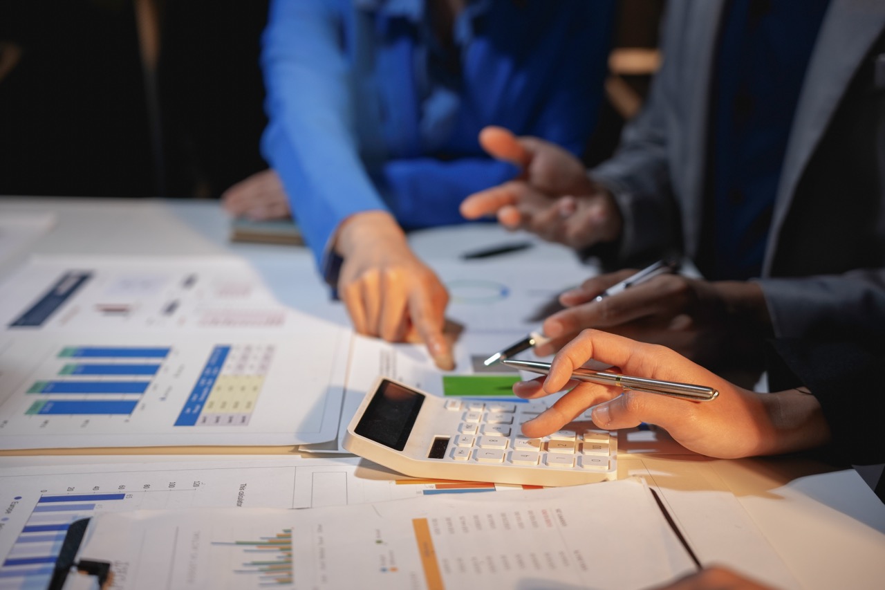 Corporate team analyzing financial documents