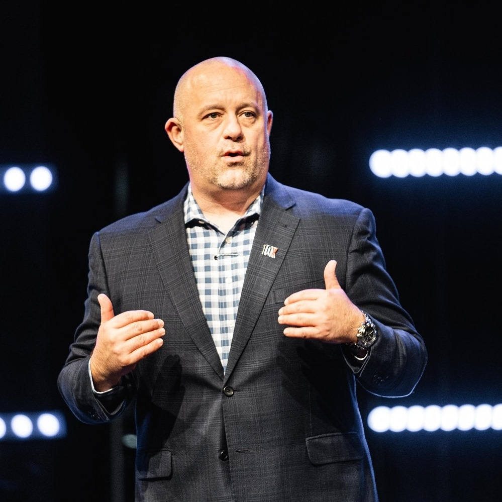 Ken Joslin speaking on stage