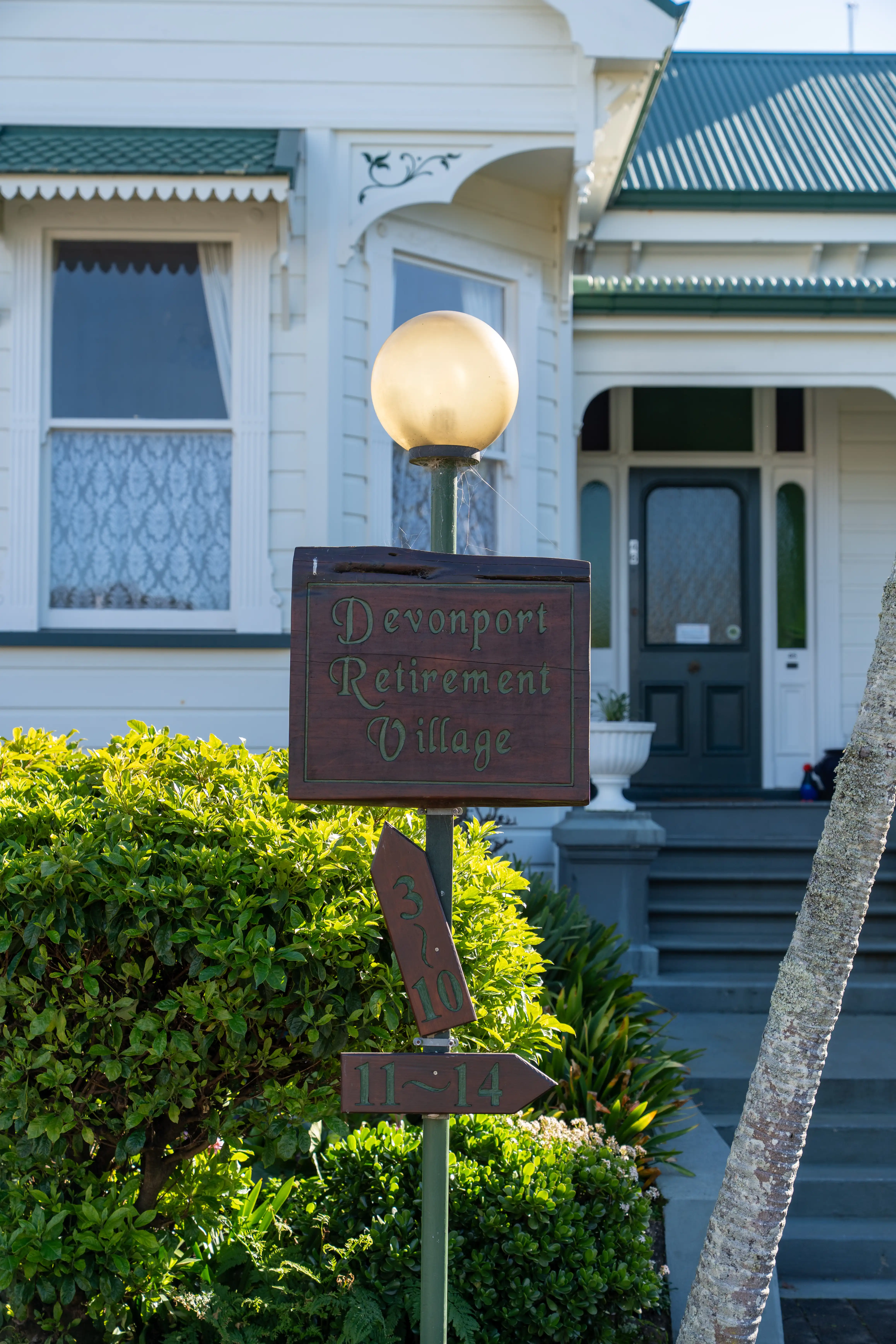 The hand-painted Devonport Retirement Village gate sign outside Alison House