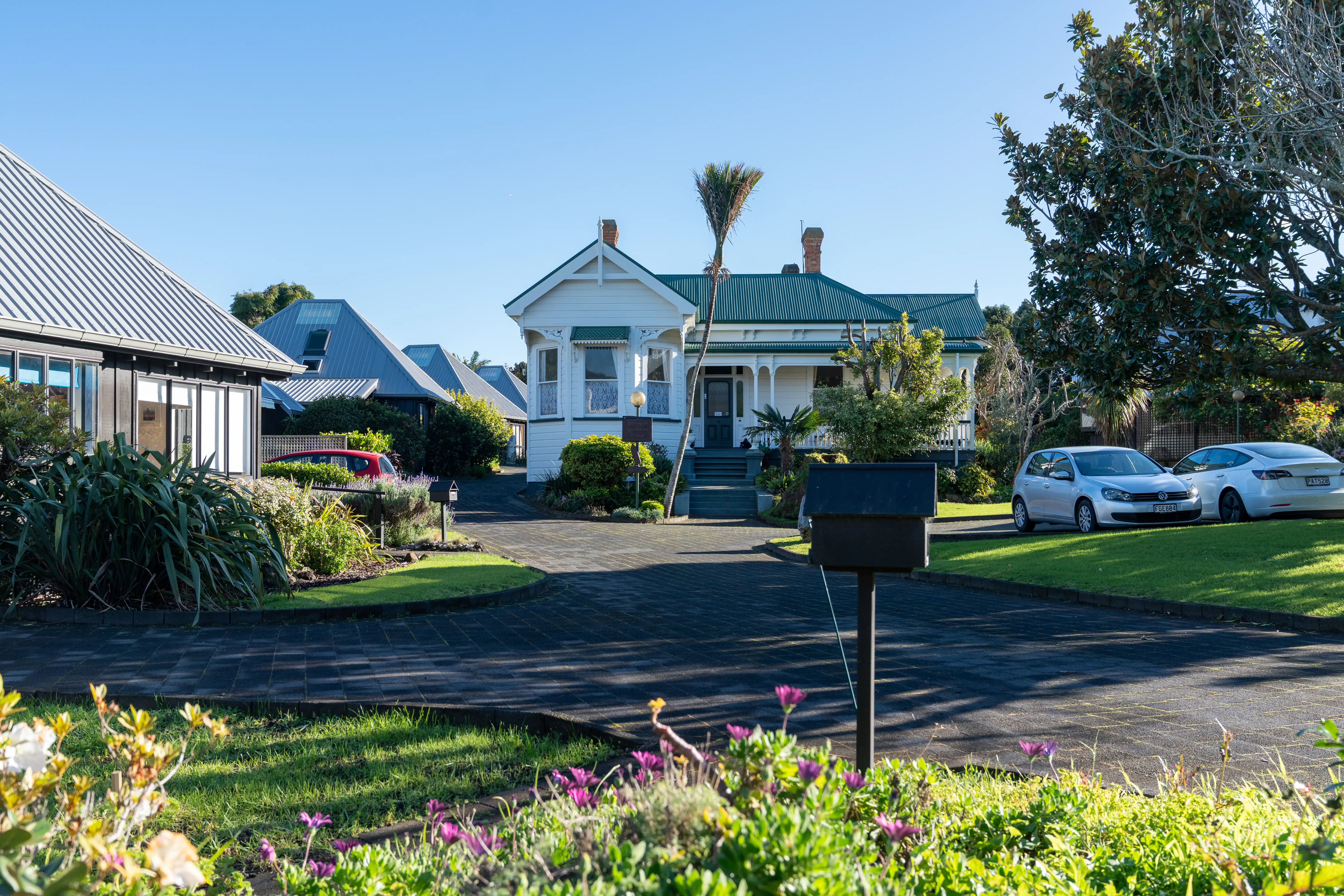 The verandah and gardens at Alison House, the village's community centre