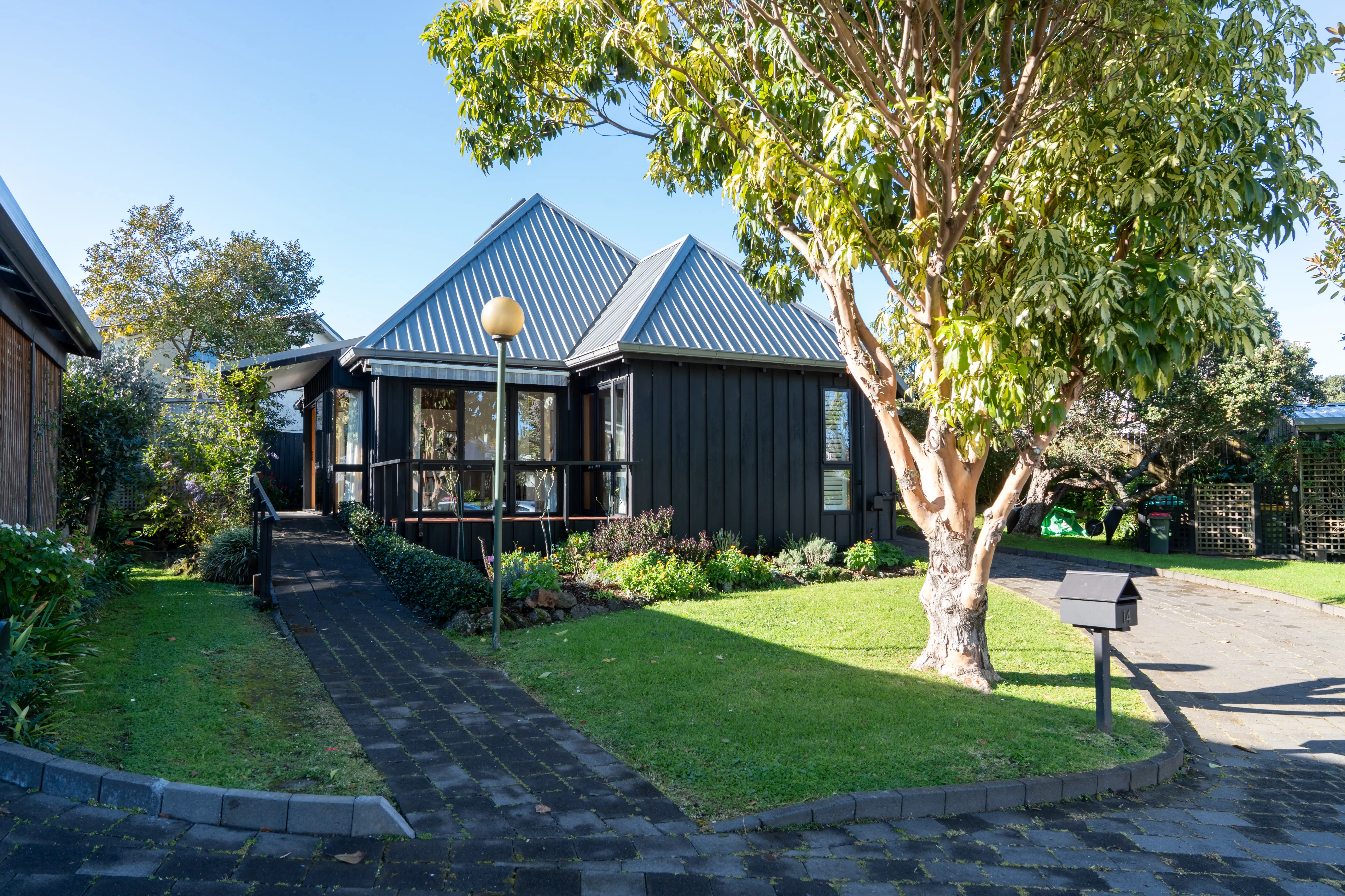 A freestanding villa at Devonport Retirement Village, with its own front path and garden.