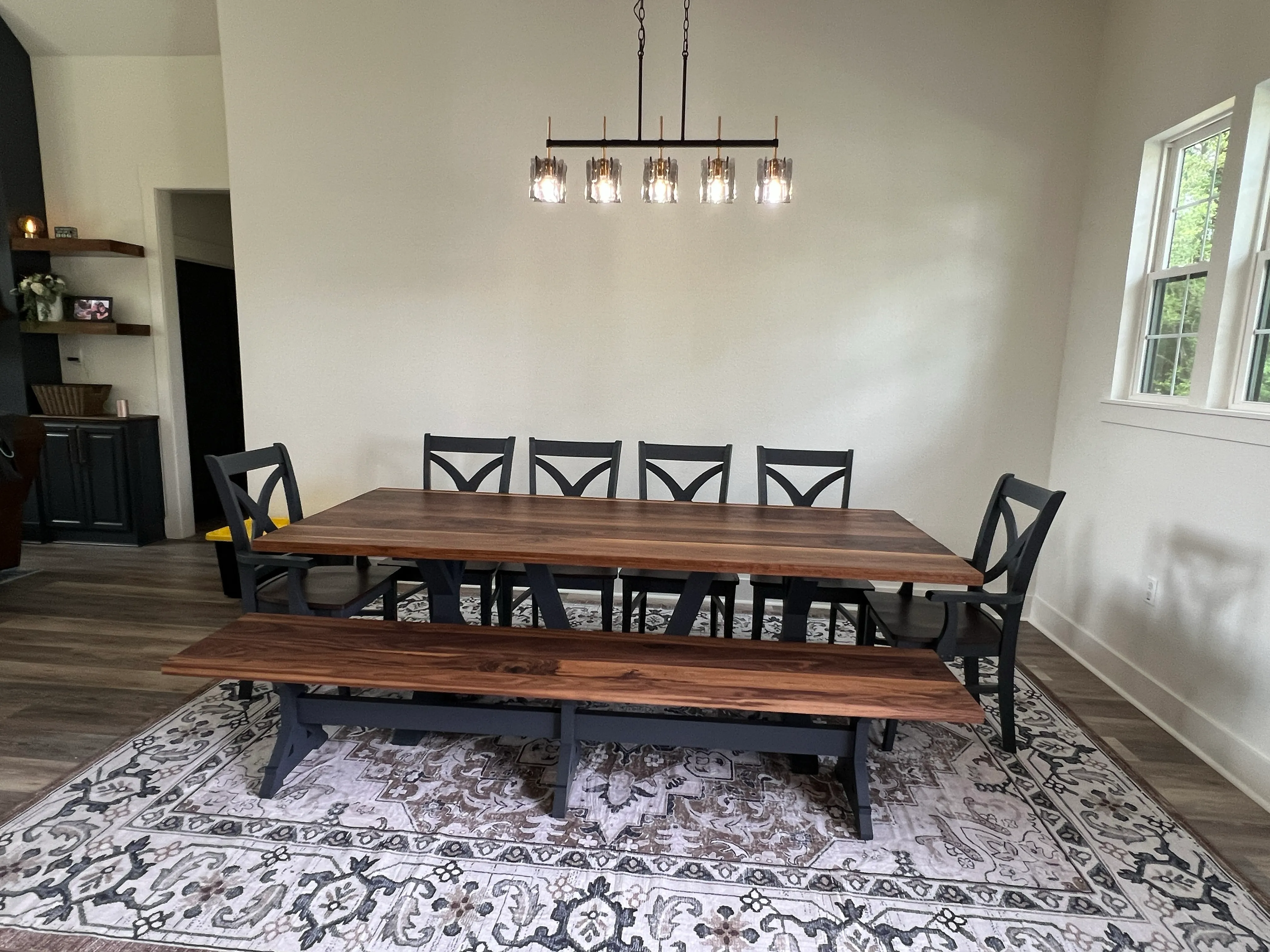 Custom walnut dining table with          chairs and bench by RedLeg Wood LLC in Mont Belvieu TX