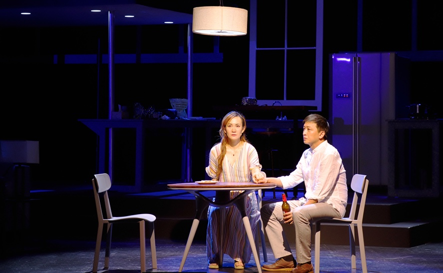 Becca and Howie sit at a small table in their home in Rabbit Hole.