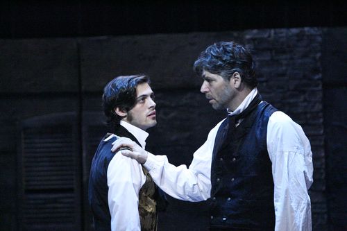 Jean Valjean speaks with Marius in a scene from Les Misérables.