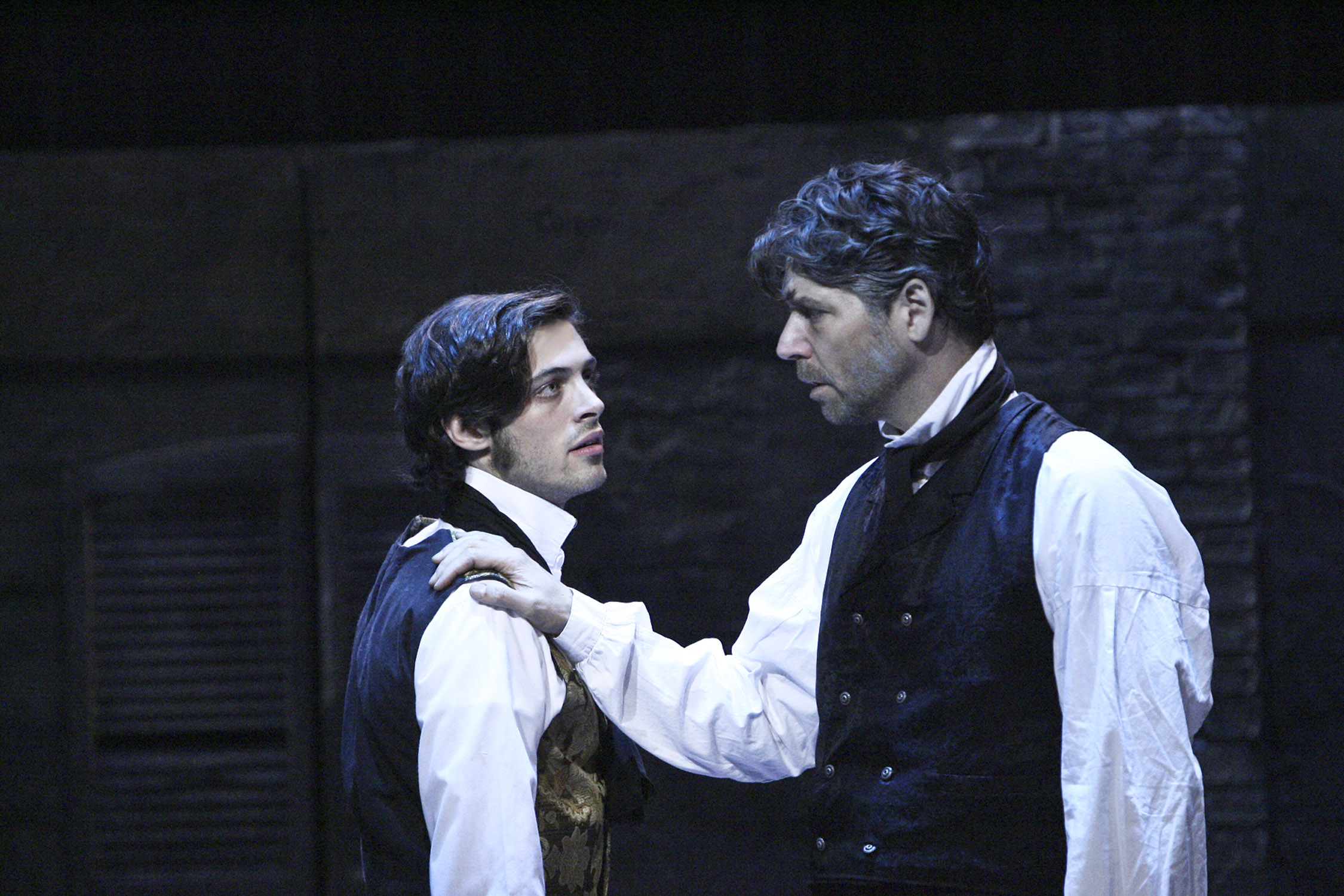 Jean Valjean speaks with Marius in a scene from Les Misérables.