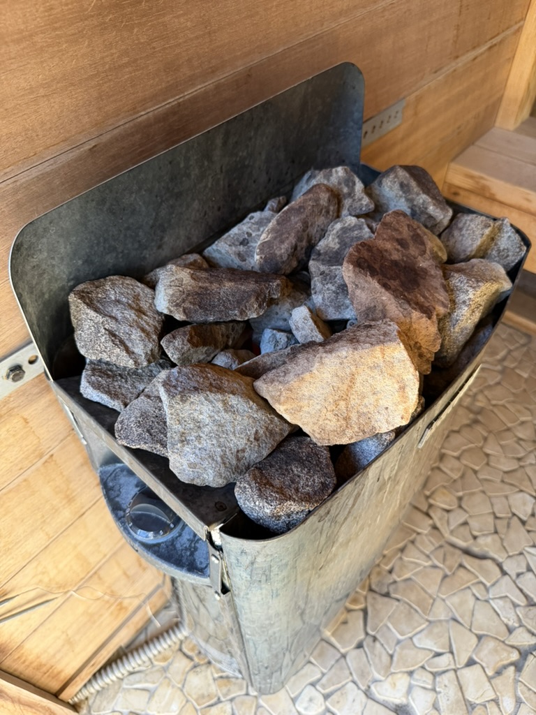 Close-up of heated sauna rocks