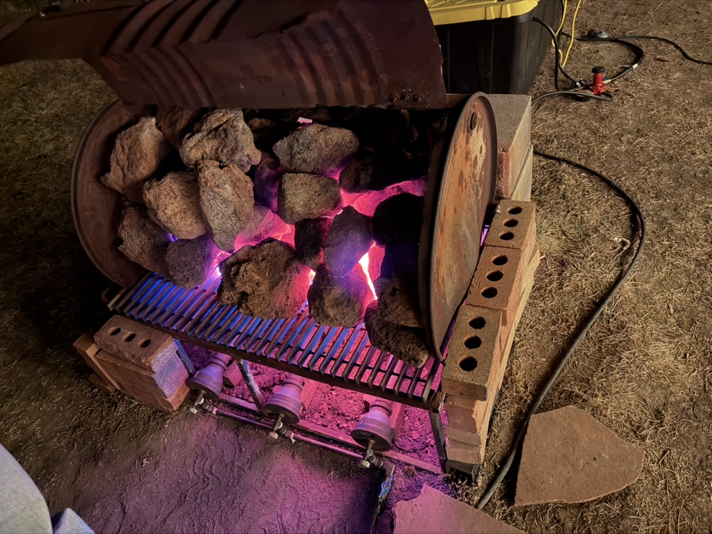 Glowing hot sauna rocks and coals