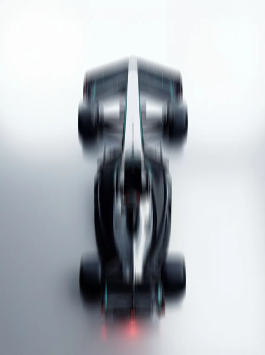 Racing car blurred head on, losing definition against a pale background