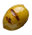 Close-up of a grilled green olive with charred marks on its surface.