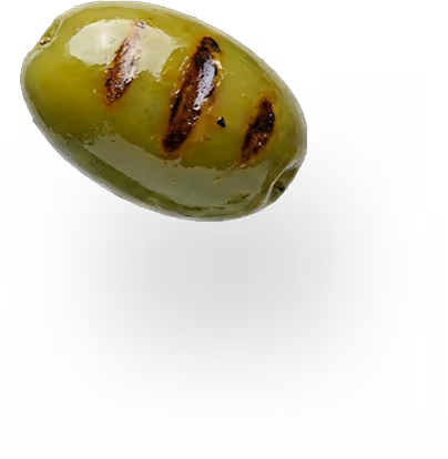 Single grilled green olive with three dark grill marks and a shadow below.