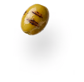 Single green olive with grill marks casting a shadow on white background.