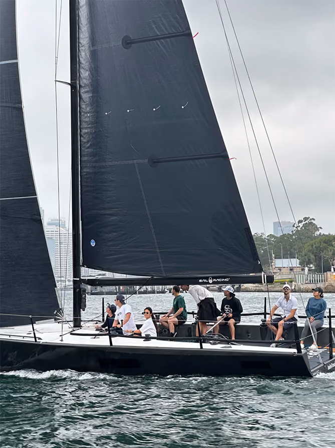 CORTO team members sailing on a racing yacht on Sydney Harbour.