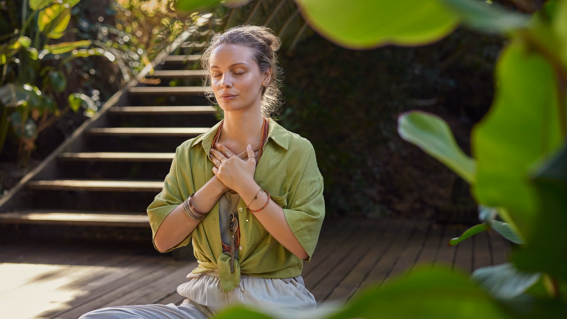 Woman practicing mindful breathing and meditation in nature for relaxation and self-regulation