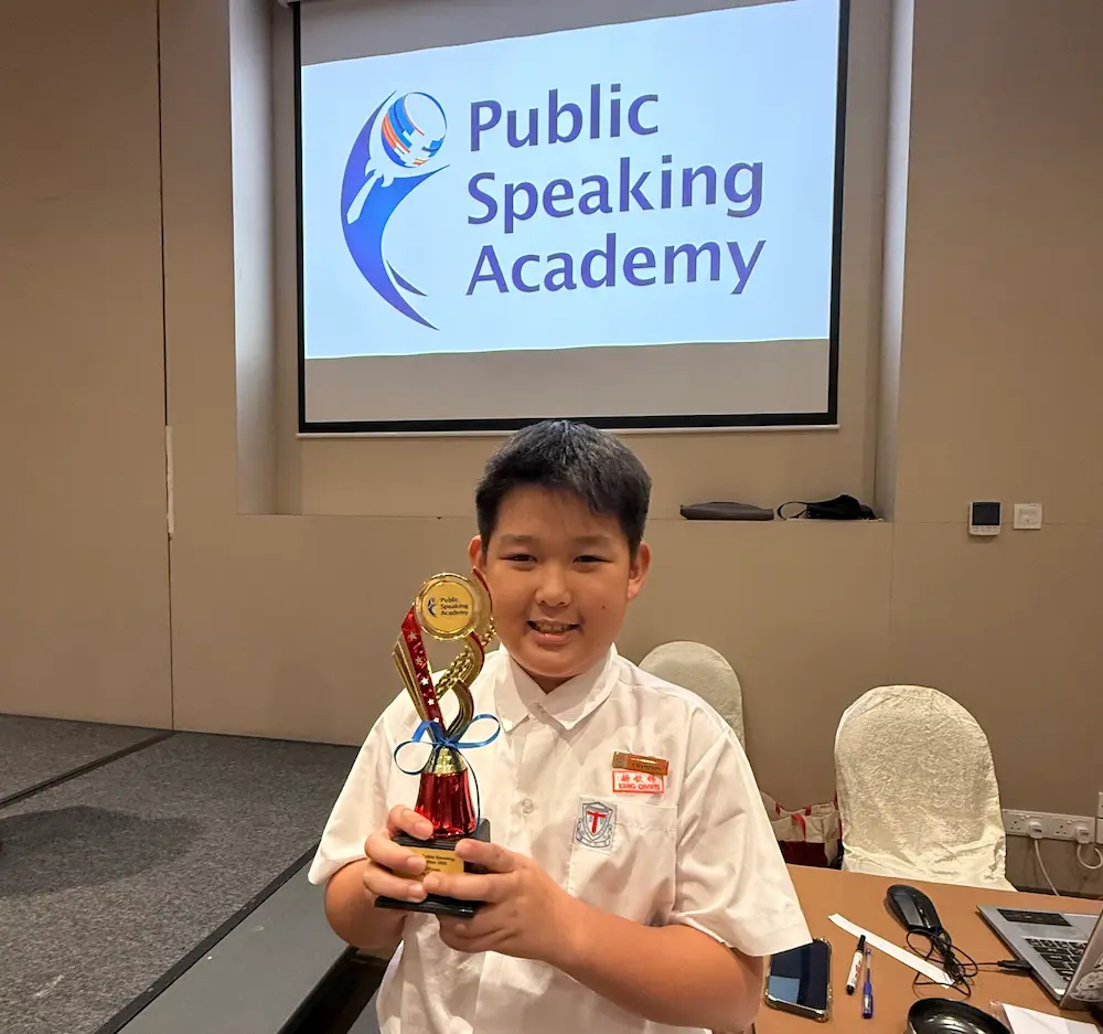 Ronnie Yang with trophy from the National Public Speaking Competition organized by Public Speaking Academy