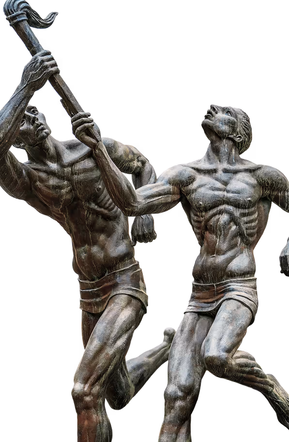 Bronze statue of two muscular men in motion, one holding a torch above his head.
