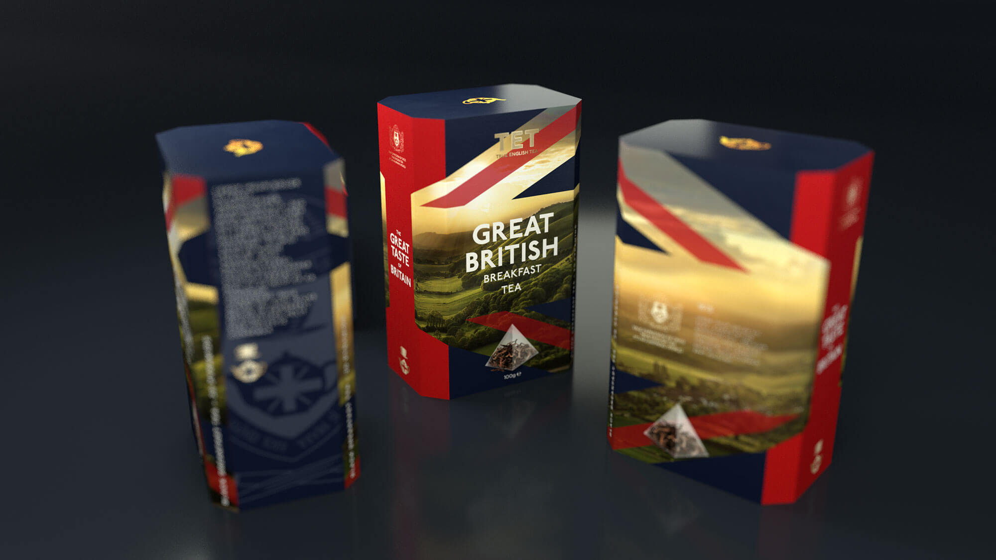 Three TET (True English Teas) tea boxes arranged at different angles, featuring the 'Great British Breakfast Tea' variety. The packaging design incorporates the Union Jack colors (navy blue, red, and gold), with scenic British countryside imagery and a tea pyramid bag illustration. The boxes are photographed against a dark background, creating a premium, sophisticated presentation of the brand.