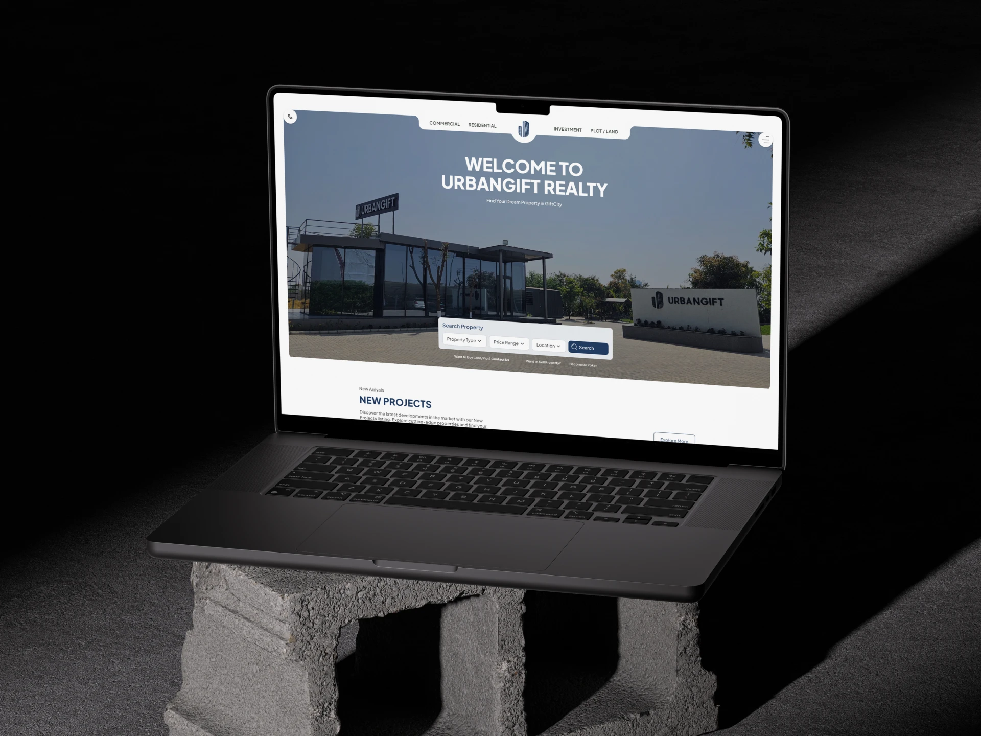 A laptop placed on a brick block displaying the message "Welcome to Mercedes-Benz" in a professional setting.