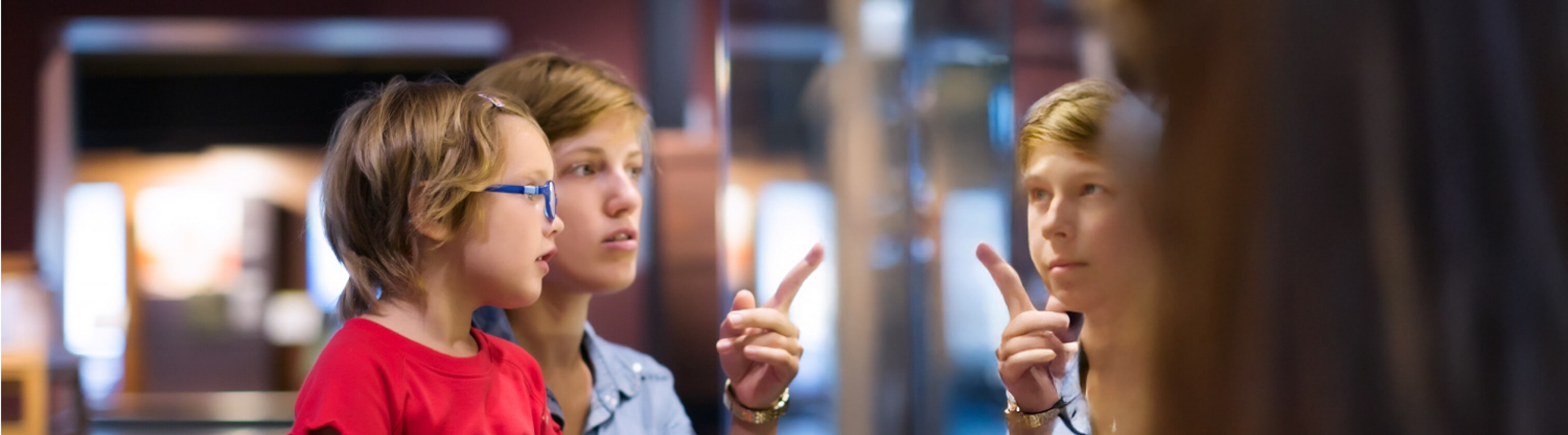 Mother pointing to a screen to her child