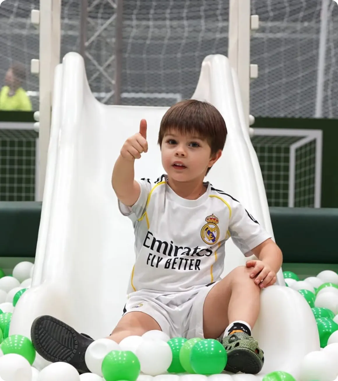 Luxury family-friendly FIFA World Cup 2026 fan zone inside a premium Dubai Festival City event tent with soft play areas, food trucks and giant football screens.