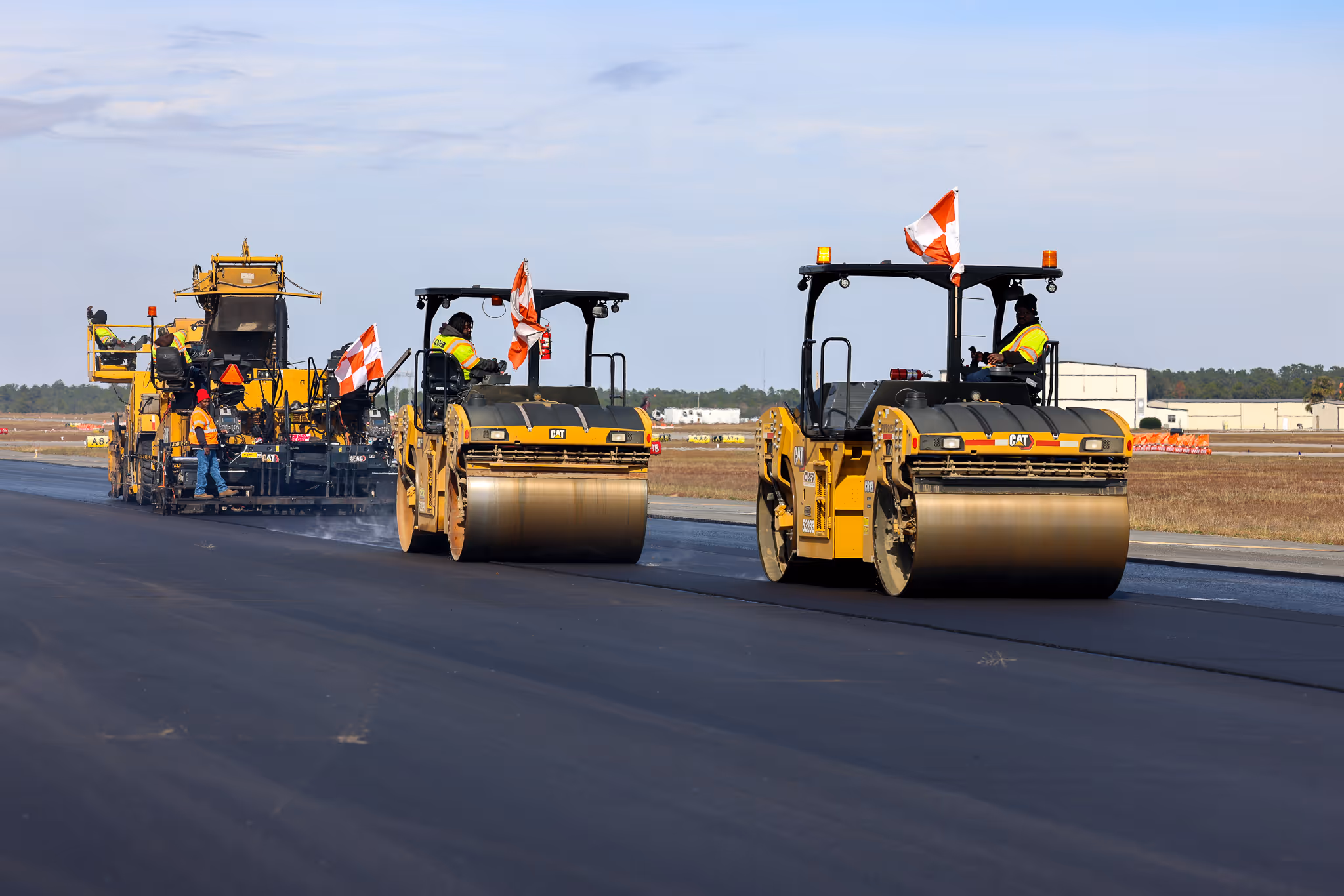 CWR Contracting paving crew on an active airport runway