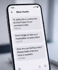 Phone screen showing health reminders including blood pressure check and medication advice.