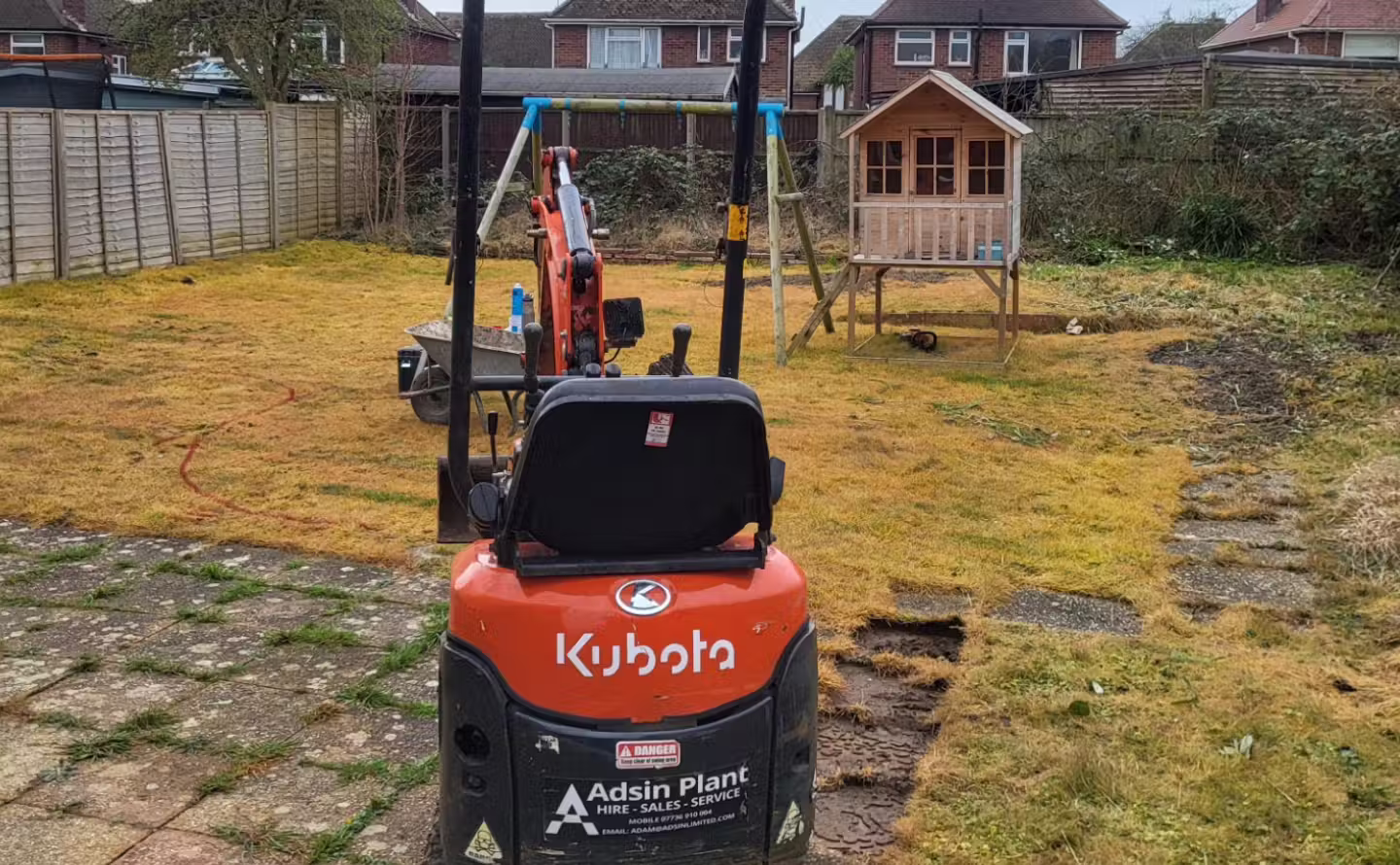 Tired garden lawn and patio space before landscaping transformation in West Sussex