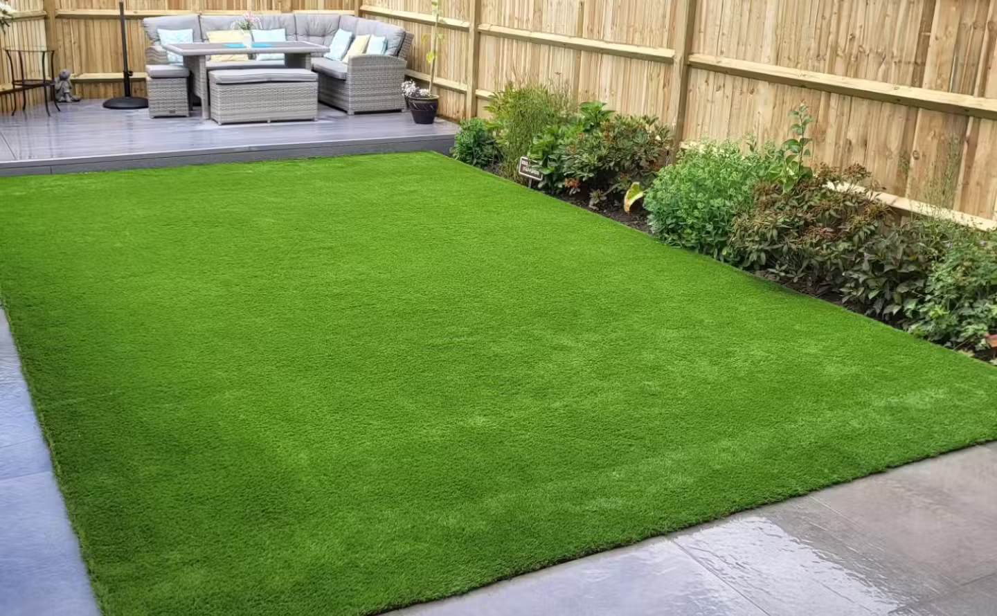 Freshly turfed lawn following landscaping work in West Sussex by Casteldine Landscapes
