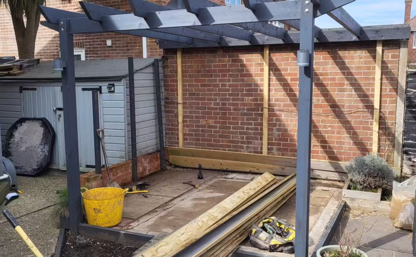 Empty garden space before patio and pergola installation in Worthing, West Sussex