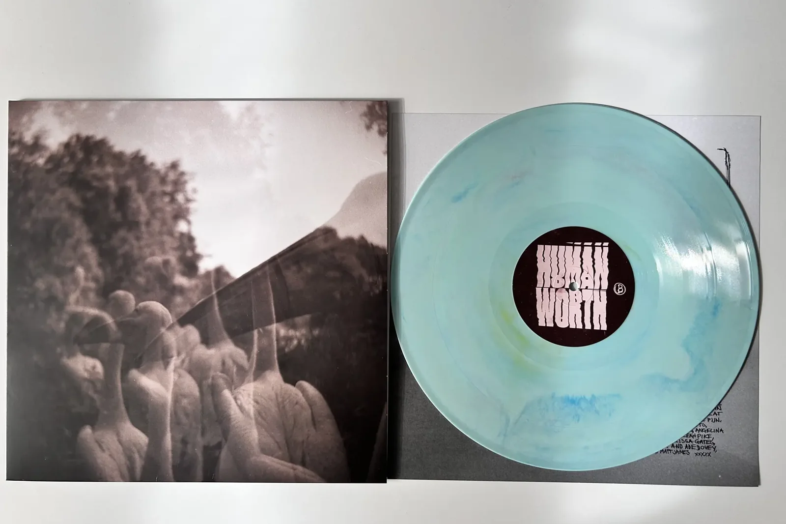 Green marbled vinyl record pressed by AGR, with its printed sleeve