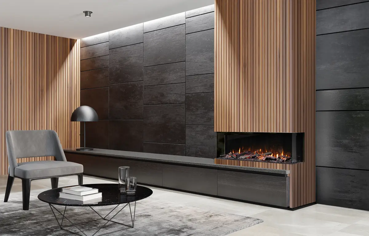 Modern living room with gray chair, black coffee table, fireplace, and wood and dark wall panels.