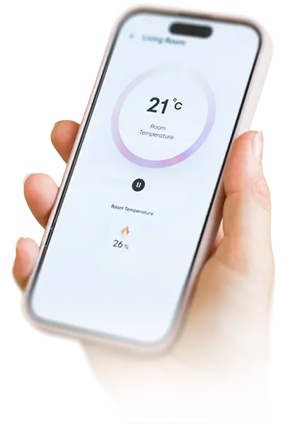 Hand holding smartphone showing smart home app with room temperature at 21°C and heating at 26%.