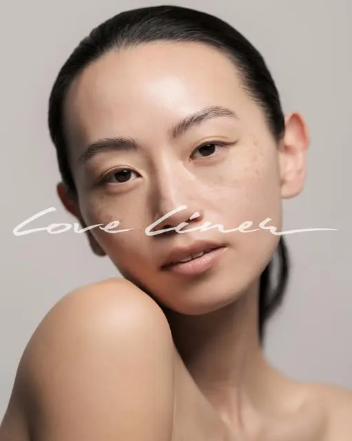 Close-up of a woman's face with natural makeup and smooth skin, text overlay reads 'Love Liner'.