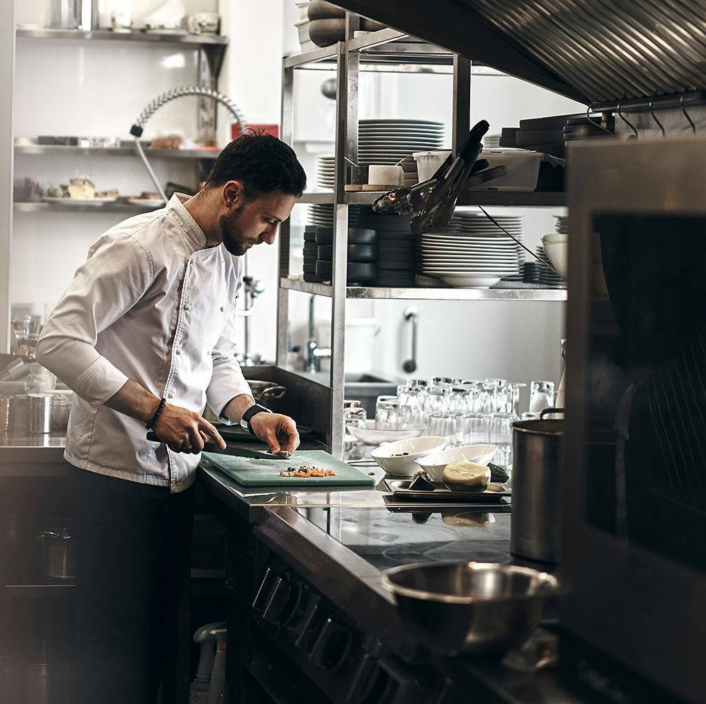 Disciplined Employee Prepping in High End Restaurant