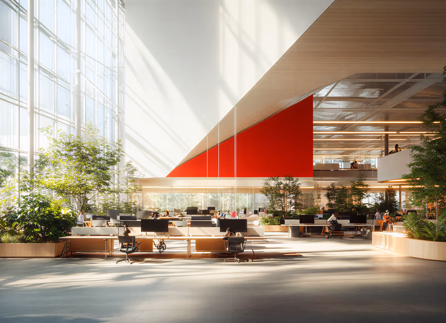 Bright modern open office space with large windows, multiple desks with computers, and abundant green plants.