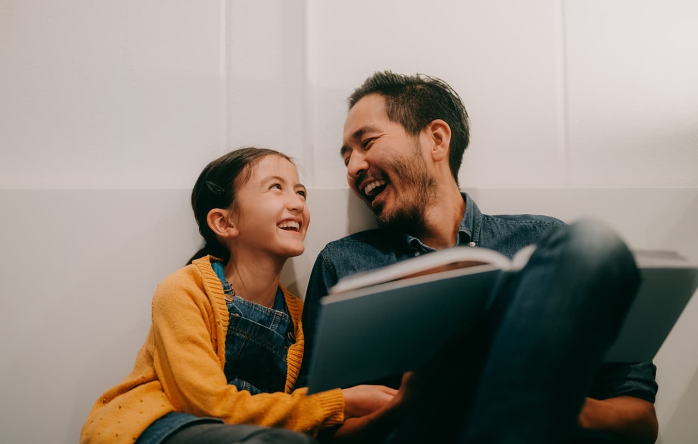 Parent and child reading together