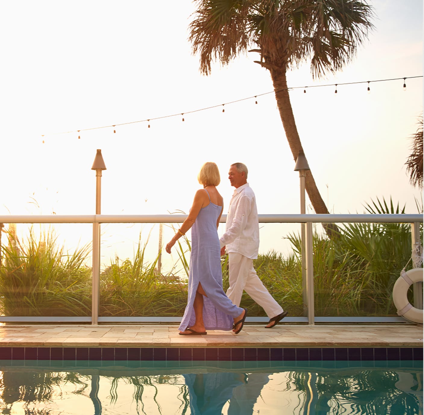 Couple enjoying retirement by the pool