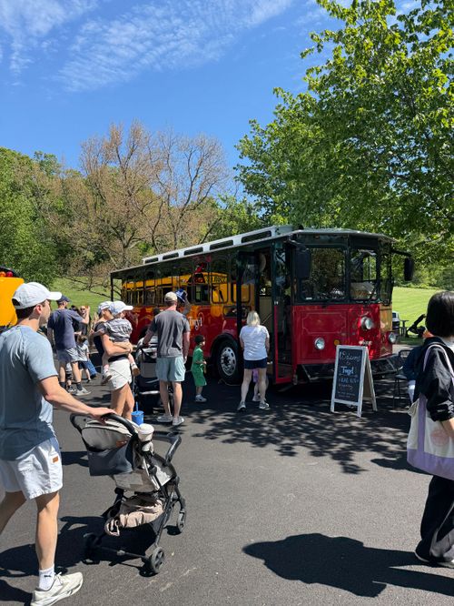 The Twyl trolley at an outdoor event with people walking around