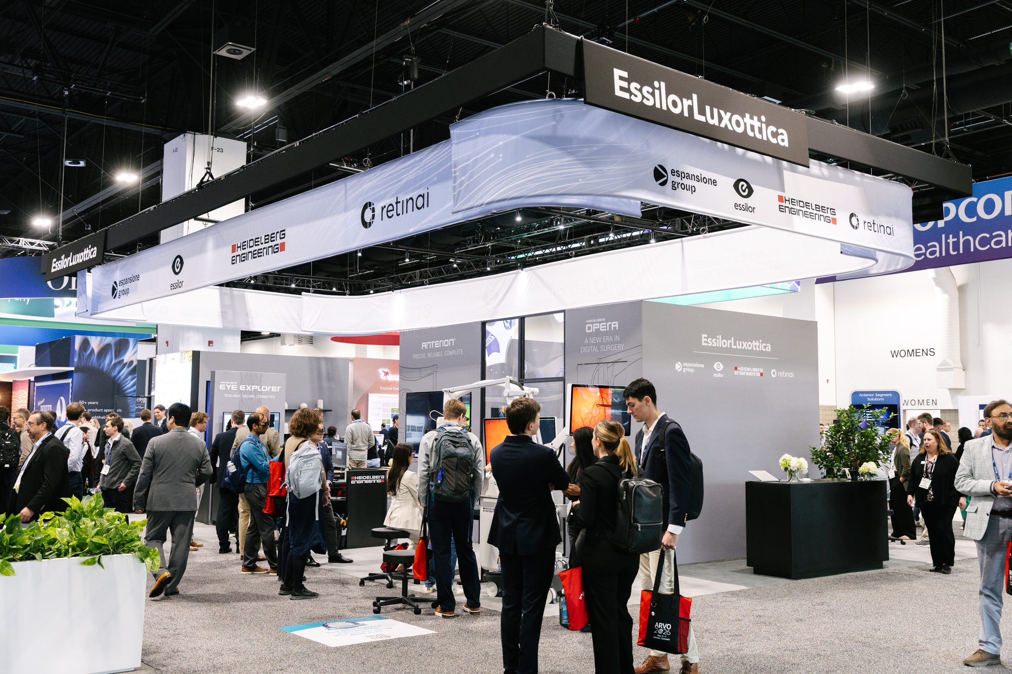 Attendees walking a large association tradeshow exhibit hall