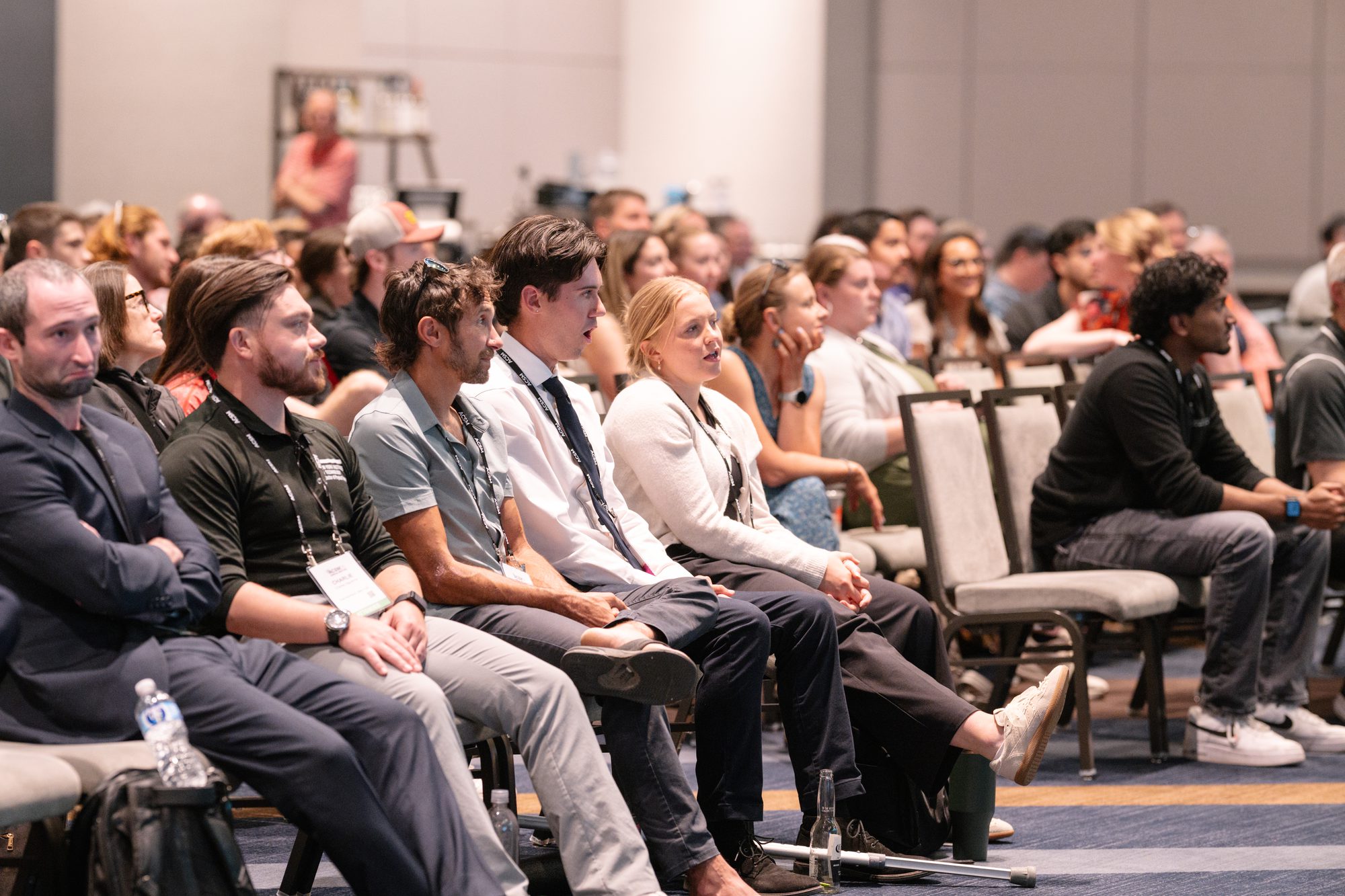Conference attendees seated and listening during a breakout session