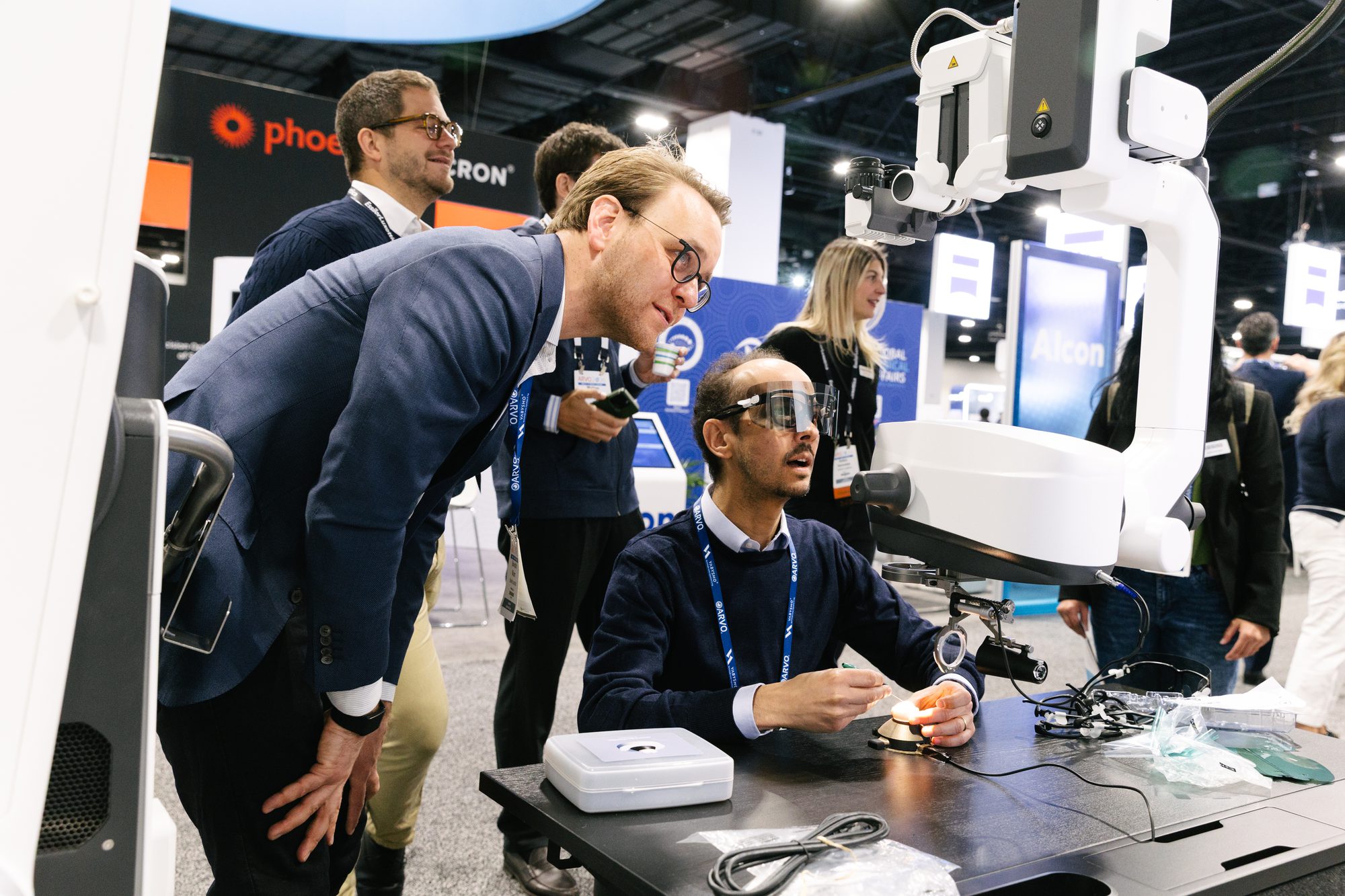 Attendee trying a hands-on product demo at a conference exhibit booth
