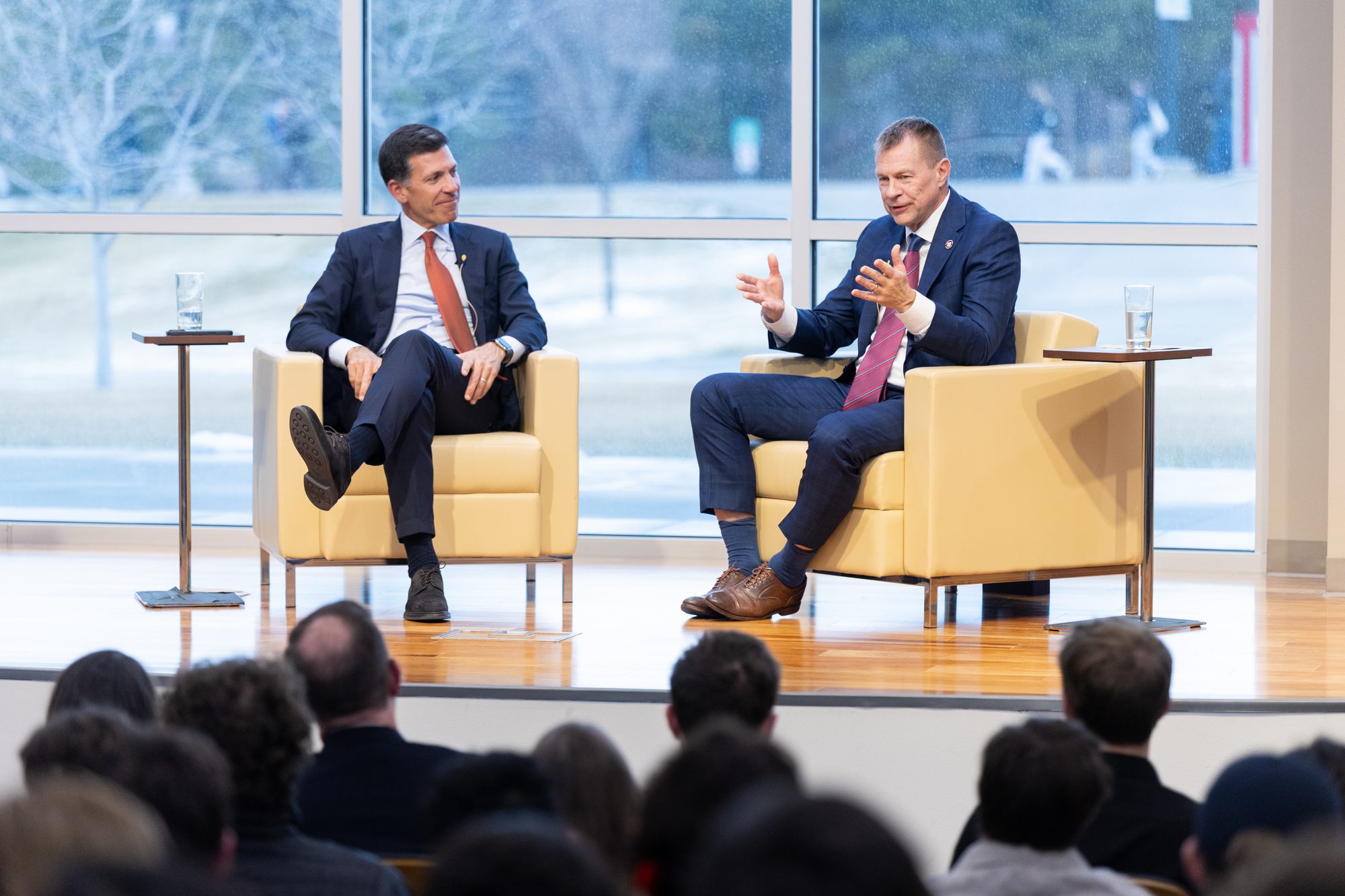 Fireside chat between two speakers on stage in front of an audience