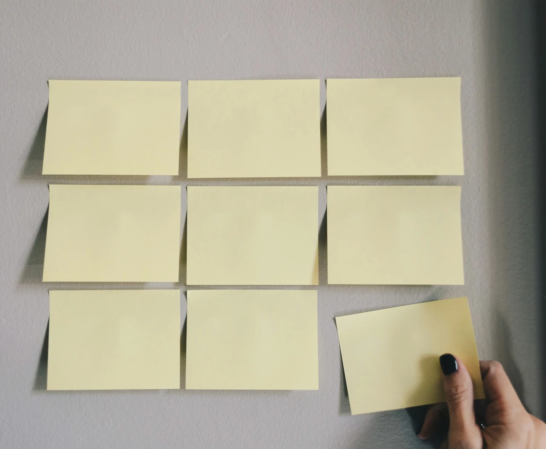 sticky notes lined up on a wall