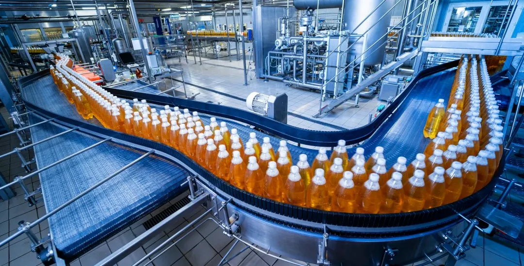 conveyor belt with lines of bottles