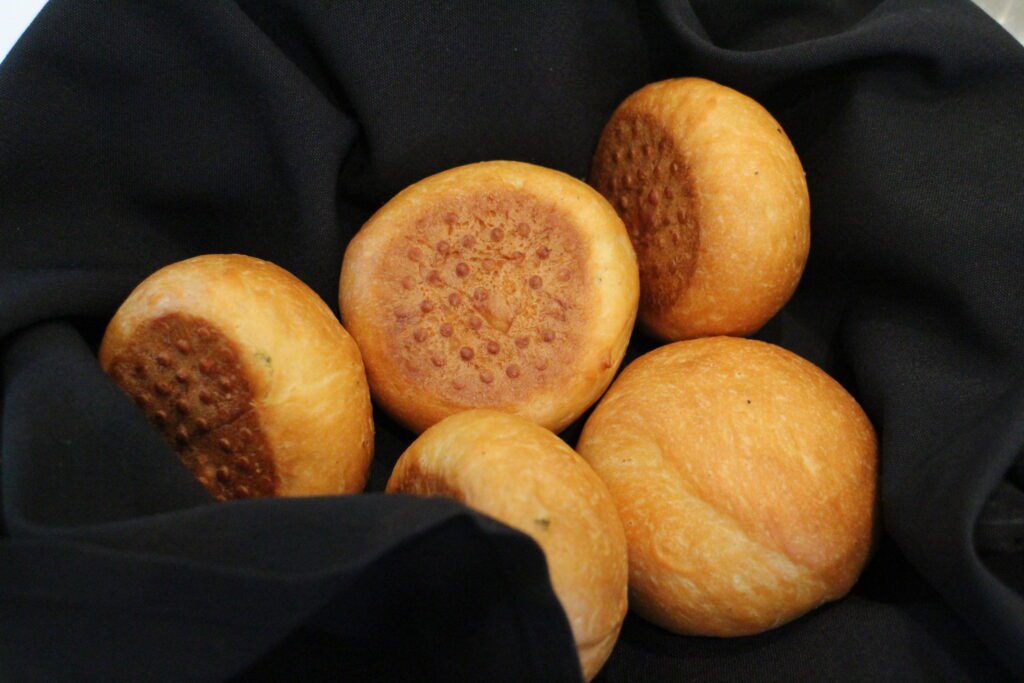 rolls in a black napkin basket
