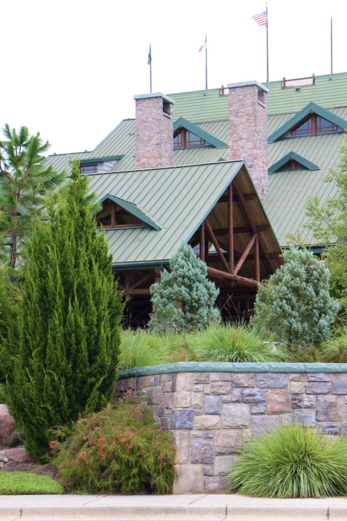 The entrance of Wilderness Lodge with green roofs, stone and landscaping.
