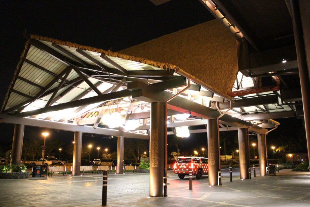 Polynesian resort porte cochere with a Minnie Van in it