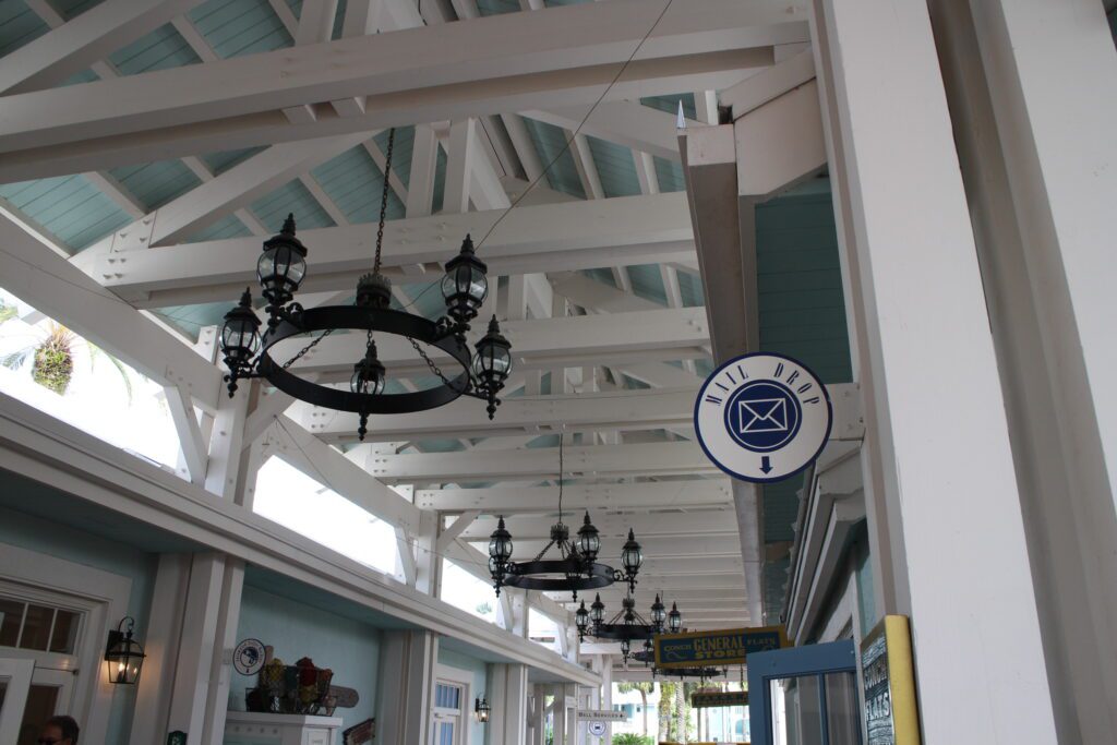 Old Key West Disney Vacation Club Resort outdoor corridor ceiling with white beams and black chandliers